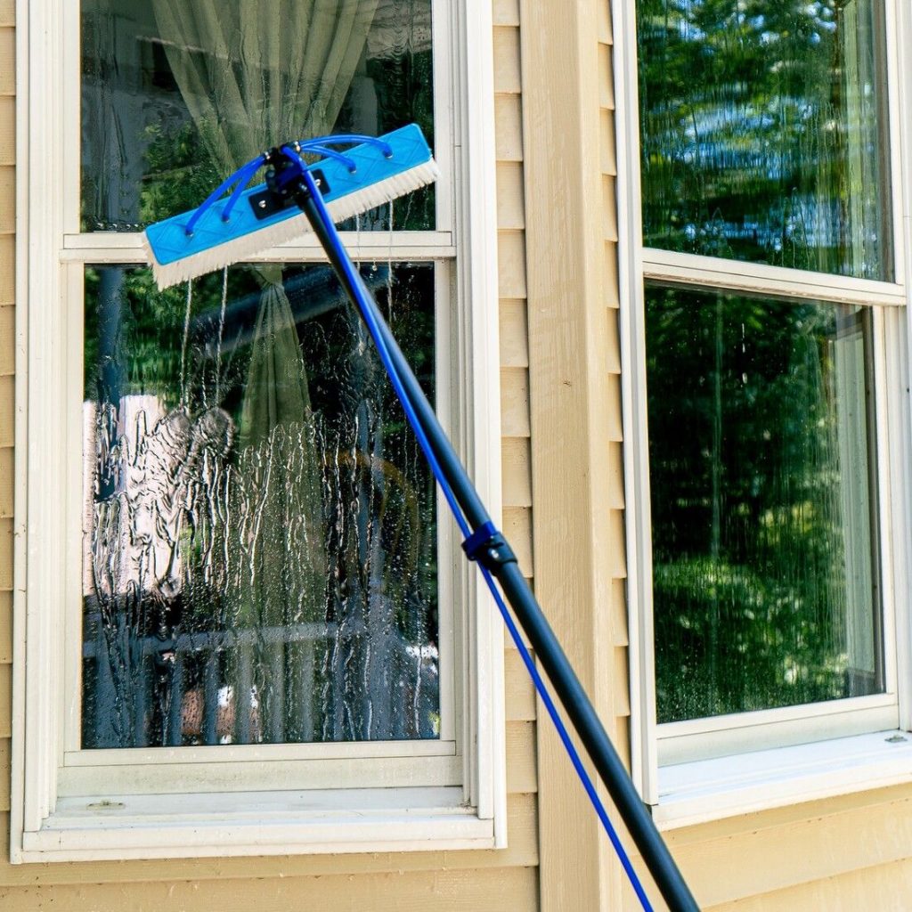 Image of Water Fed Pole cleaning a window